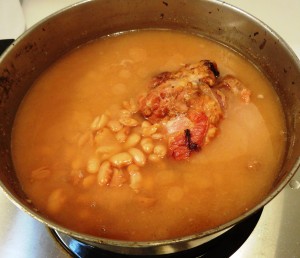 Pot of pinto beans cooked with ham hock