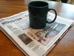 Mug of bone broth and newspaper